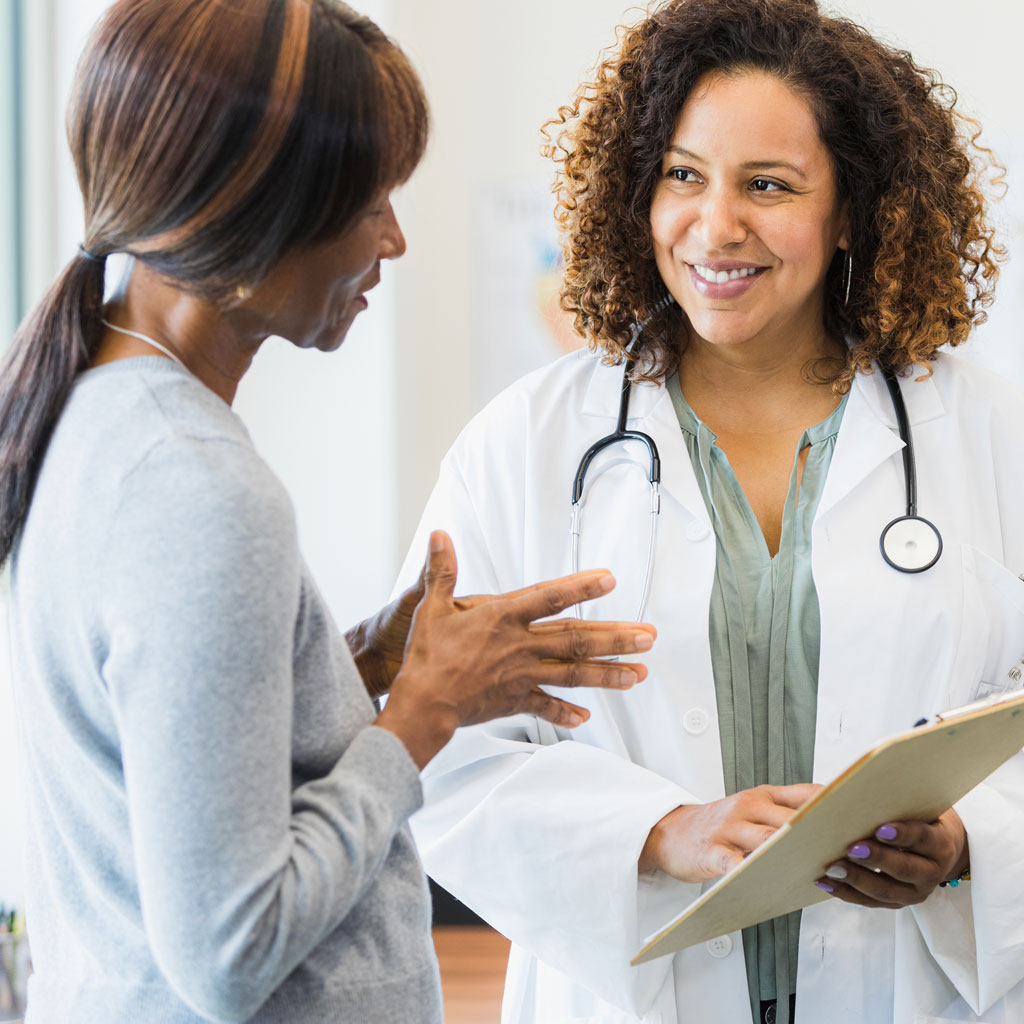 Woman asking doctor if she is a good candidate for UFE